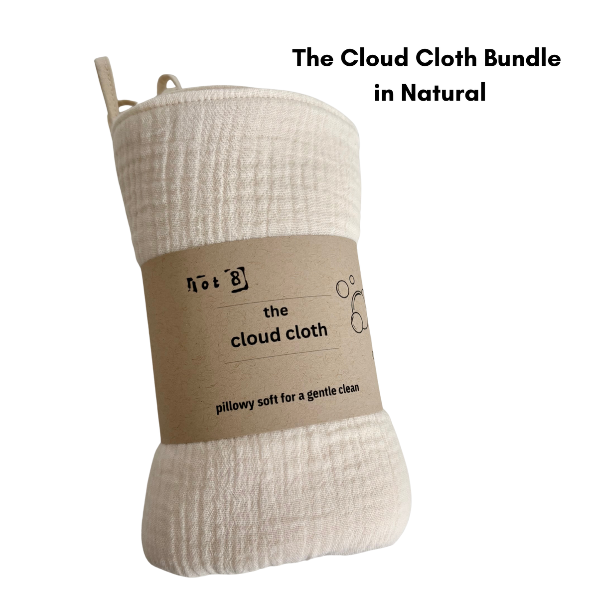 4 cloud cloths in natural are bundled with a kraft belly band announcing their name. The tag line reads: "Pillowy soft for a gentle clean"