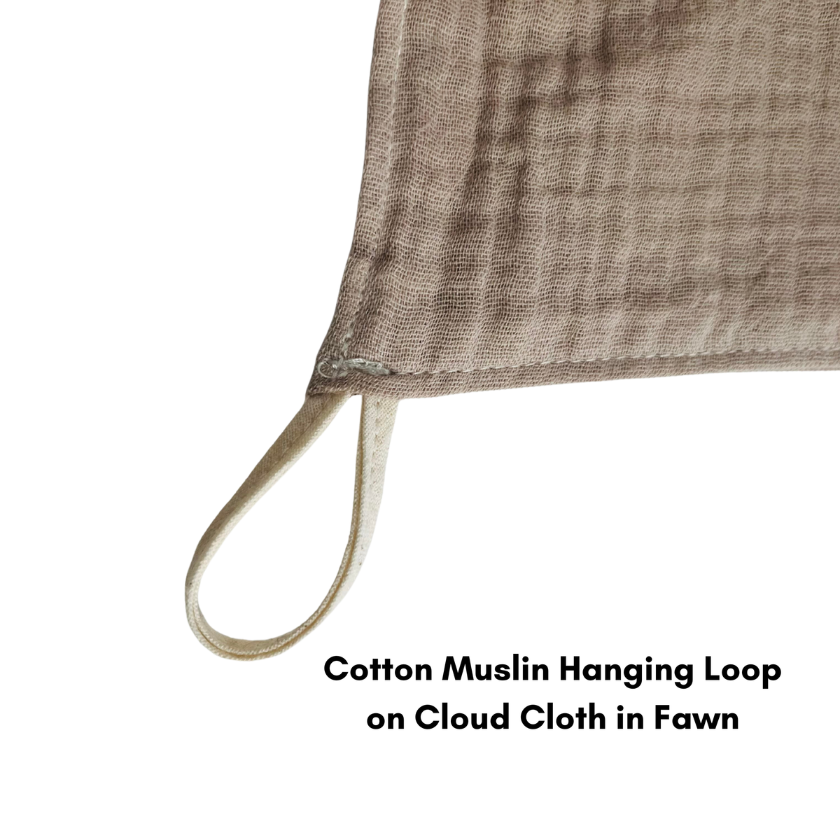 A close up of a muslin cotton loop sewn into a cloud cloth in fawn