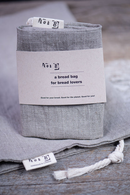 The bread bag is packaged with a simple natural coloured belly band that reads, "a bread bag for bread lovers". 