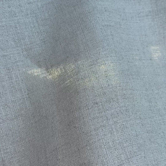 The natural linen waves in the breeze.