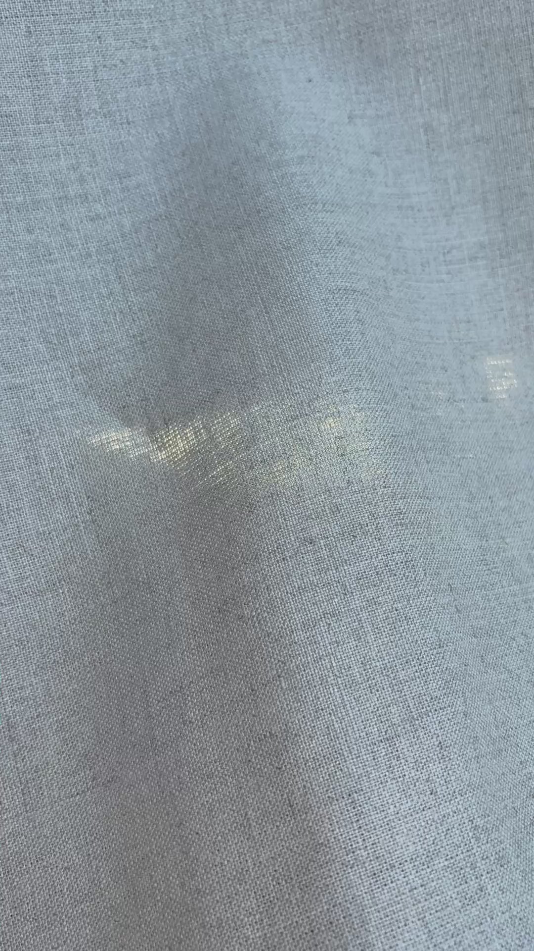 The natural linen waves in the breeze.