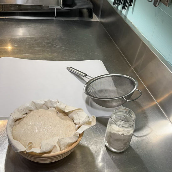 Kim is removing the proofed dough from the banneton. The bannekin is easy to remove and then can be hung to dry.
