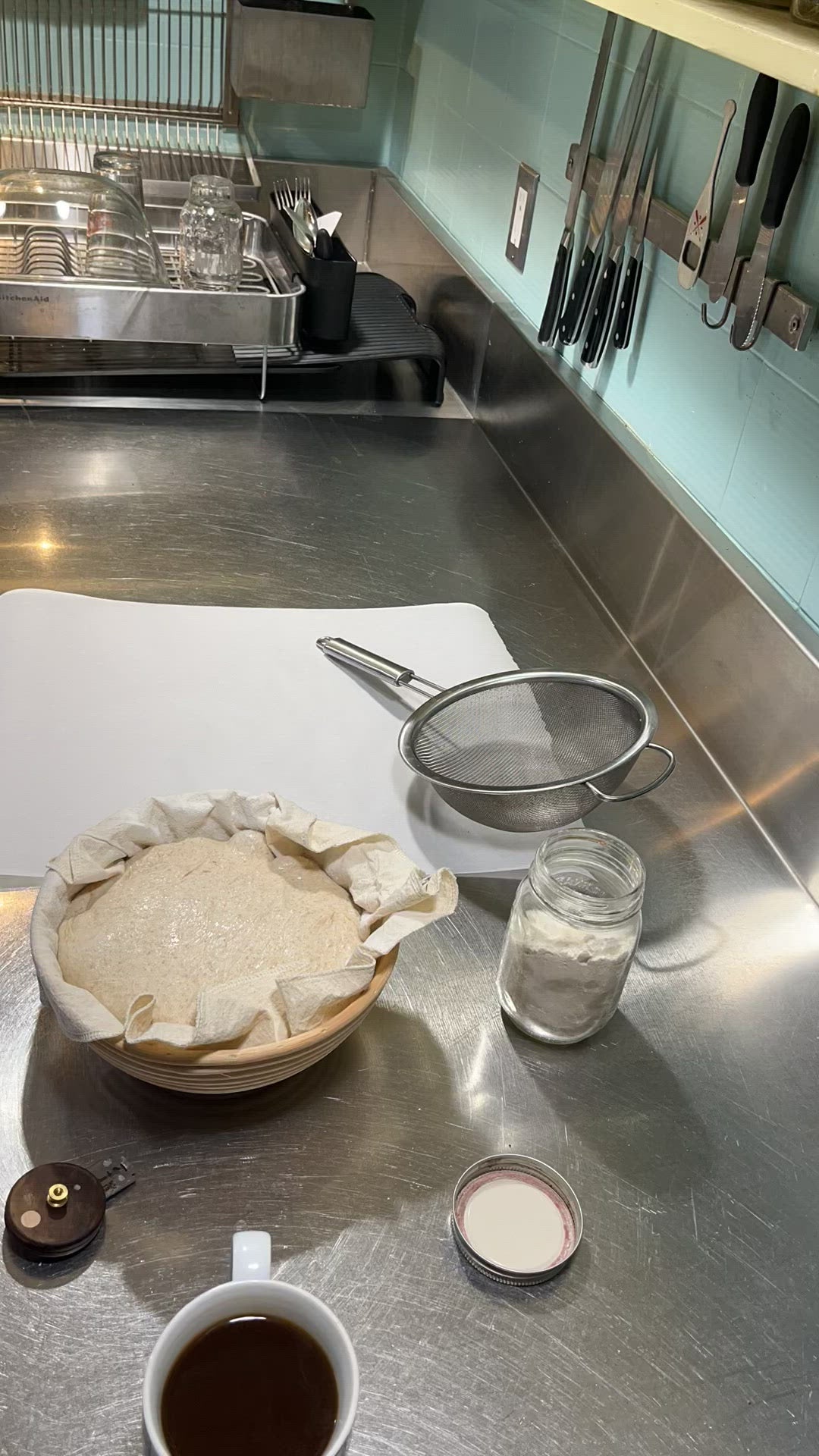 Kim is removing the proofed dough from the banneton. The bannekin is easy to remove and then can be hung to dry.