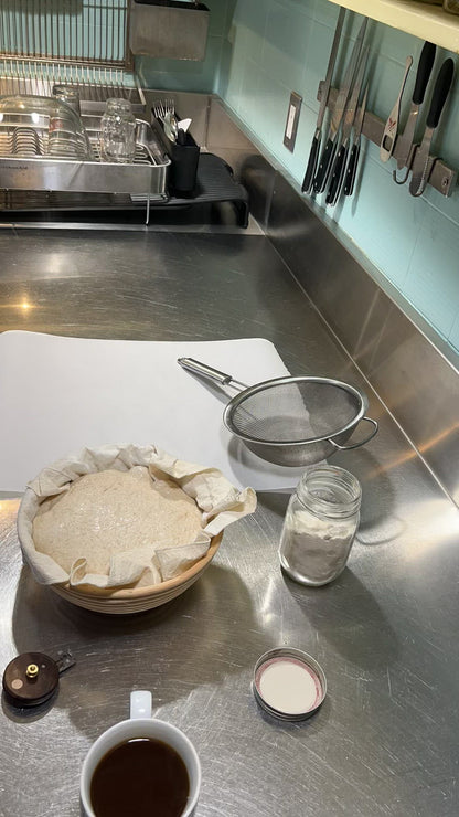 Kim is removing the proofed dough from the banneton. The bannekin is easy to remove and then can be hung to dry.