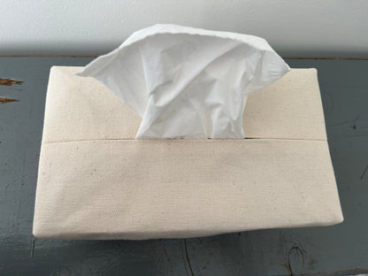 An upclose image of the opening for the tissue topstitched for durability