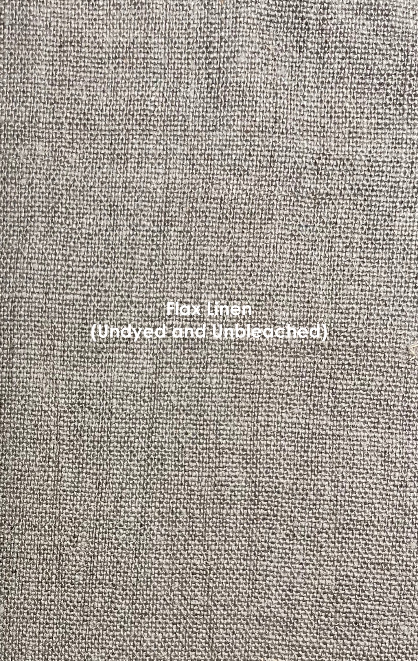A close up of flax linen (undyed and unbleached). It reads as taupe