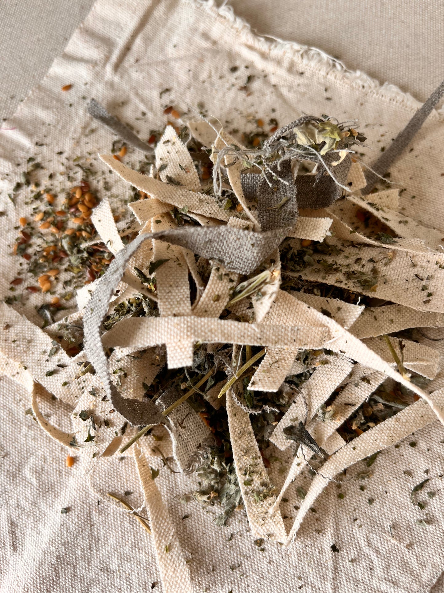 The filling of the natural cat toy is shown here. It is a blend of natural fabric scraps, flax seed and catnip.