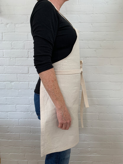 Side view of woman wearing cotton canvas apron 