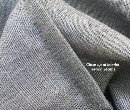 A close up detail of french seams of the hand-sewn bread bag. The raw edges of fabric are completely encased for a durable product.