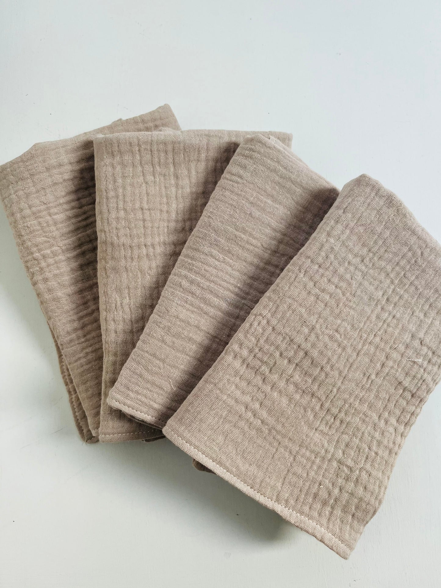 A set of four face cloths